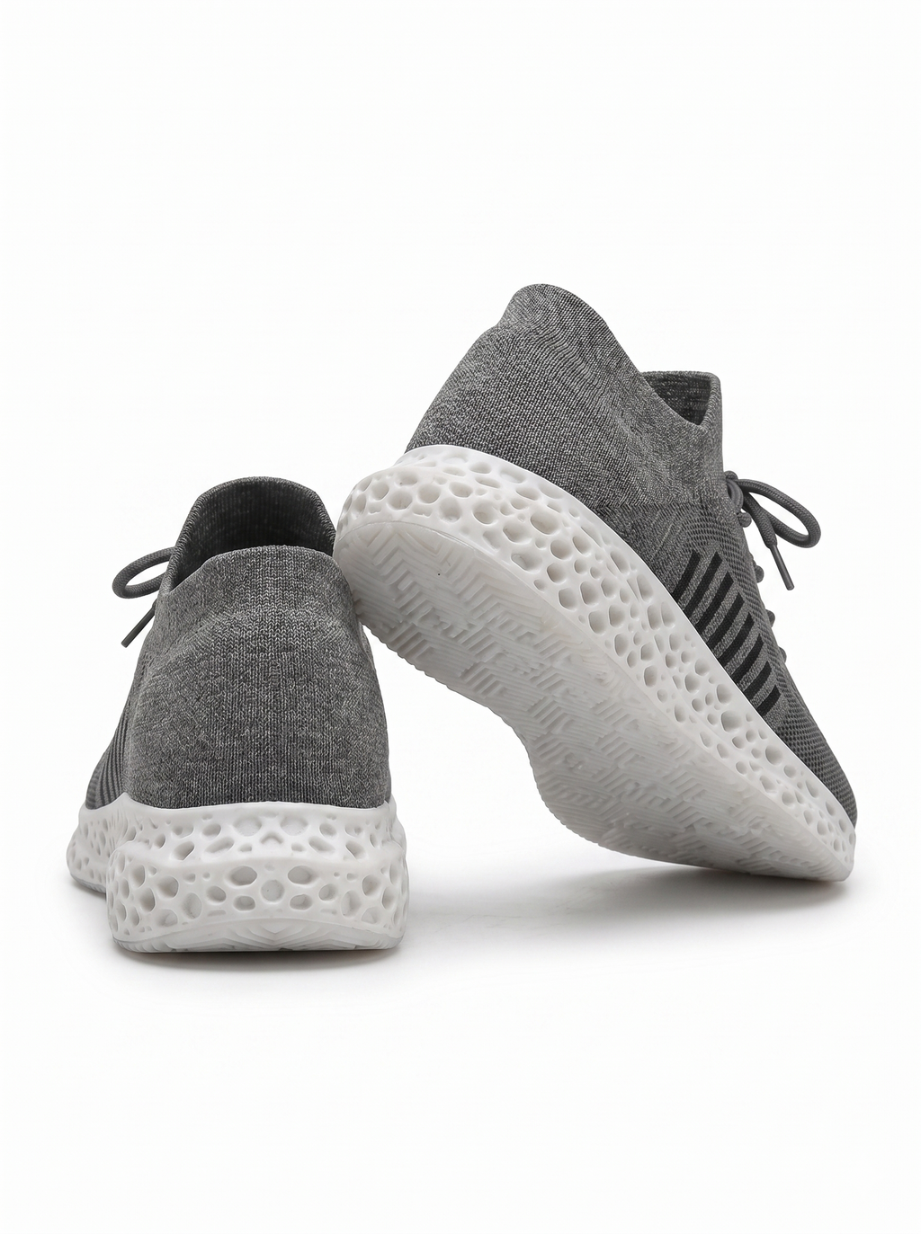 Black gray and white 3D-printed knit sneaker rear and outsole view