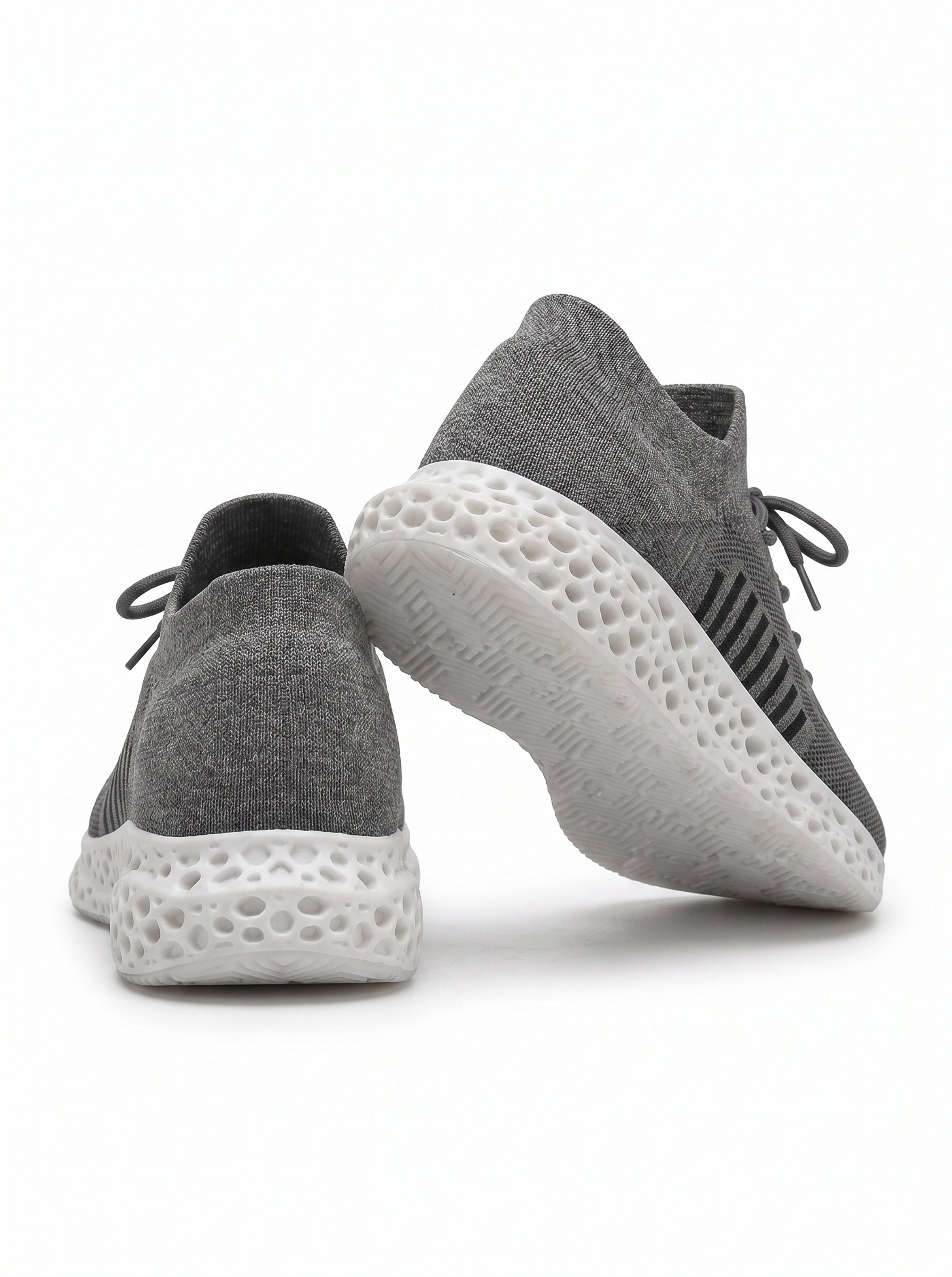 Black gray and white 3D-printed knit sneaker rear and outsole view